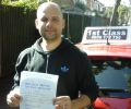 Aluisio with Driving test pass certificate